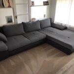 This is a photo of a grey L shape sofa that has been professionally steam cleaned, also the beige carpets have been steam cleaned too works carried out by Clapham Carpet Cleaning Solutions